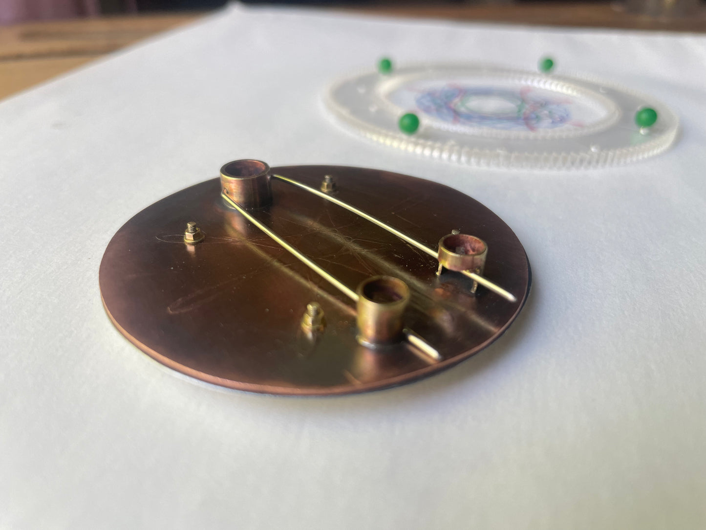 Spirograph brooch with screws